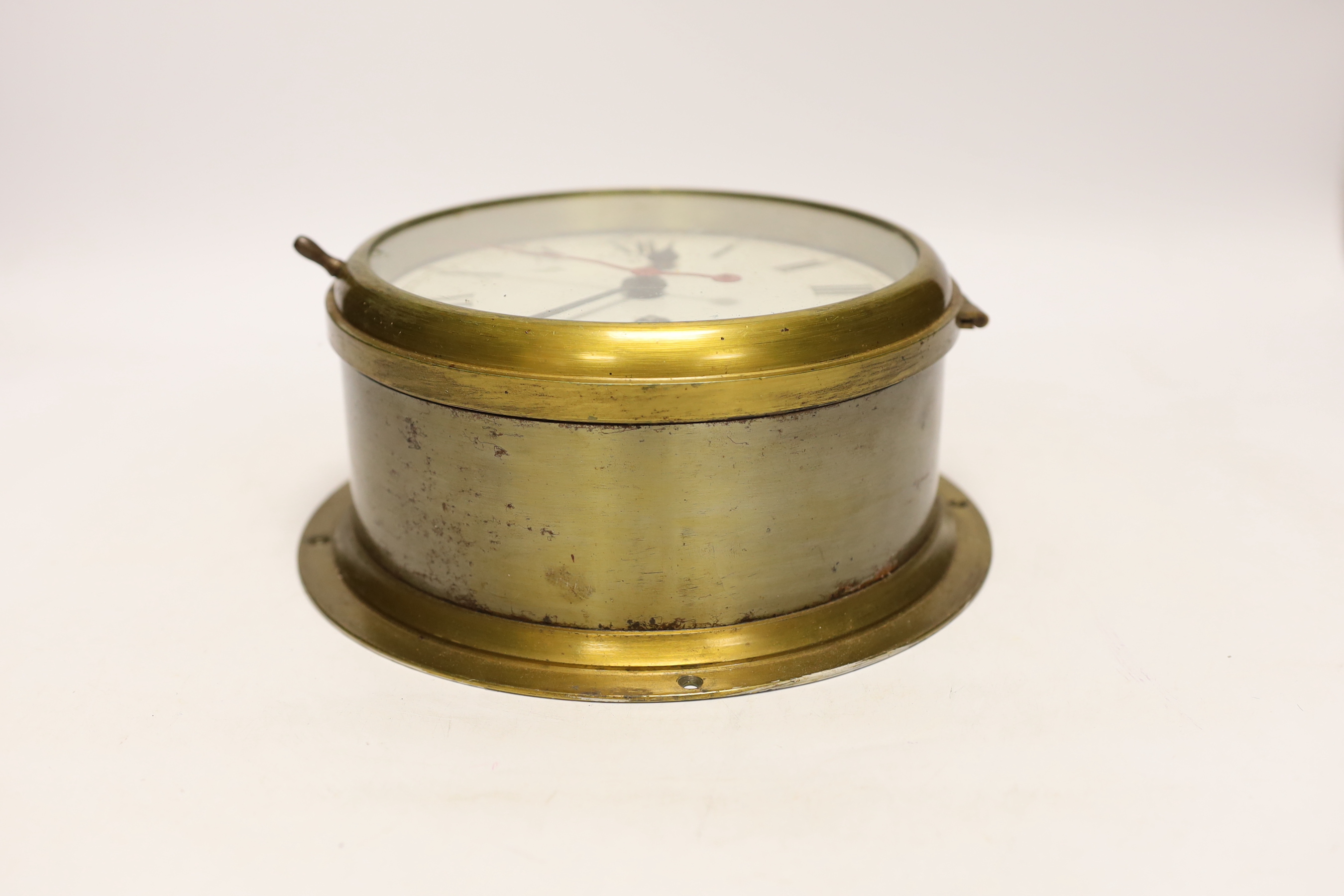 A brass bulkhead timepiece, 19.5cm